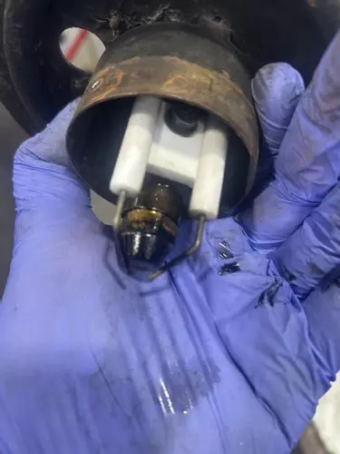 Old Burner Nozzle And Electrodes Before Service